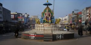 Mohan Nagar roundabout with a large statue at the center and busy city streets around it, representing the area for students searching for NEET Coaching Near Mohan Nagar.